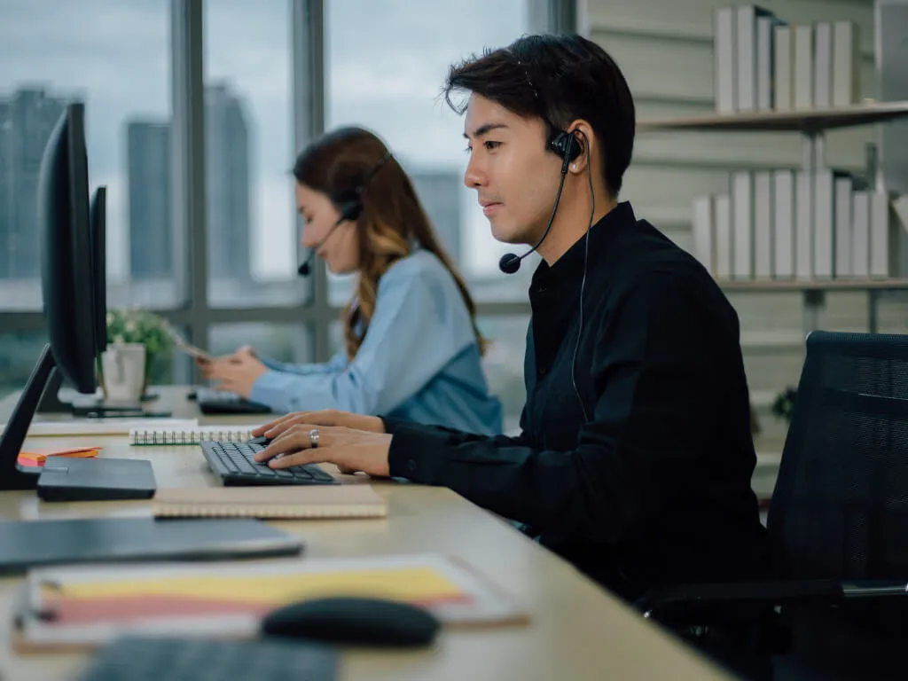 A side view of a plate of figs and berries.